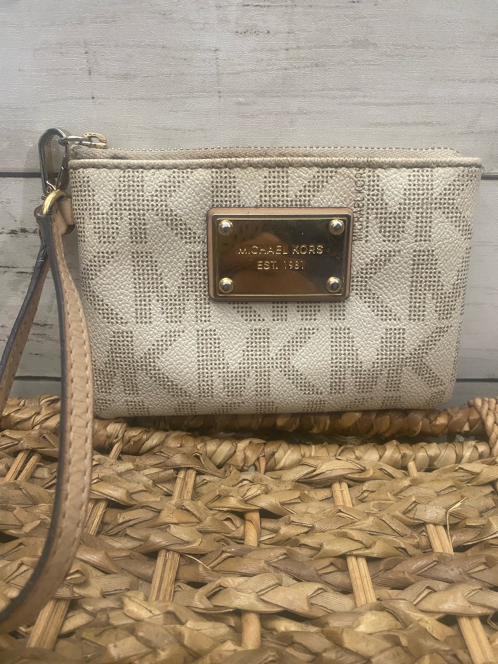 Michael Korsβ Cream Logo Wristlet with Gold Plaque